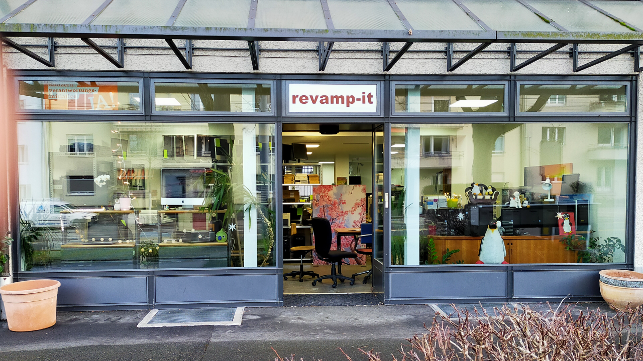 RevampIT storefront with large windows displaying computers and equipment